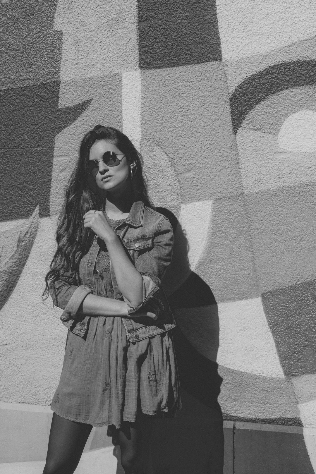 Belgian businesswoman with glasses and long dark hair